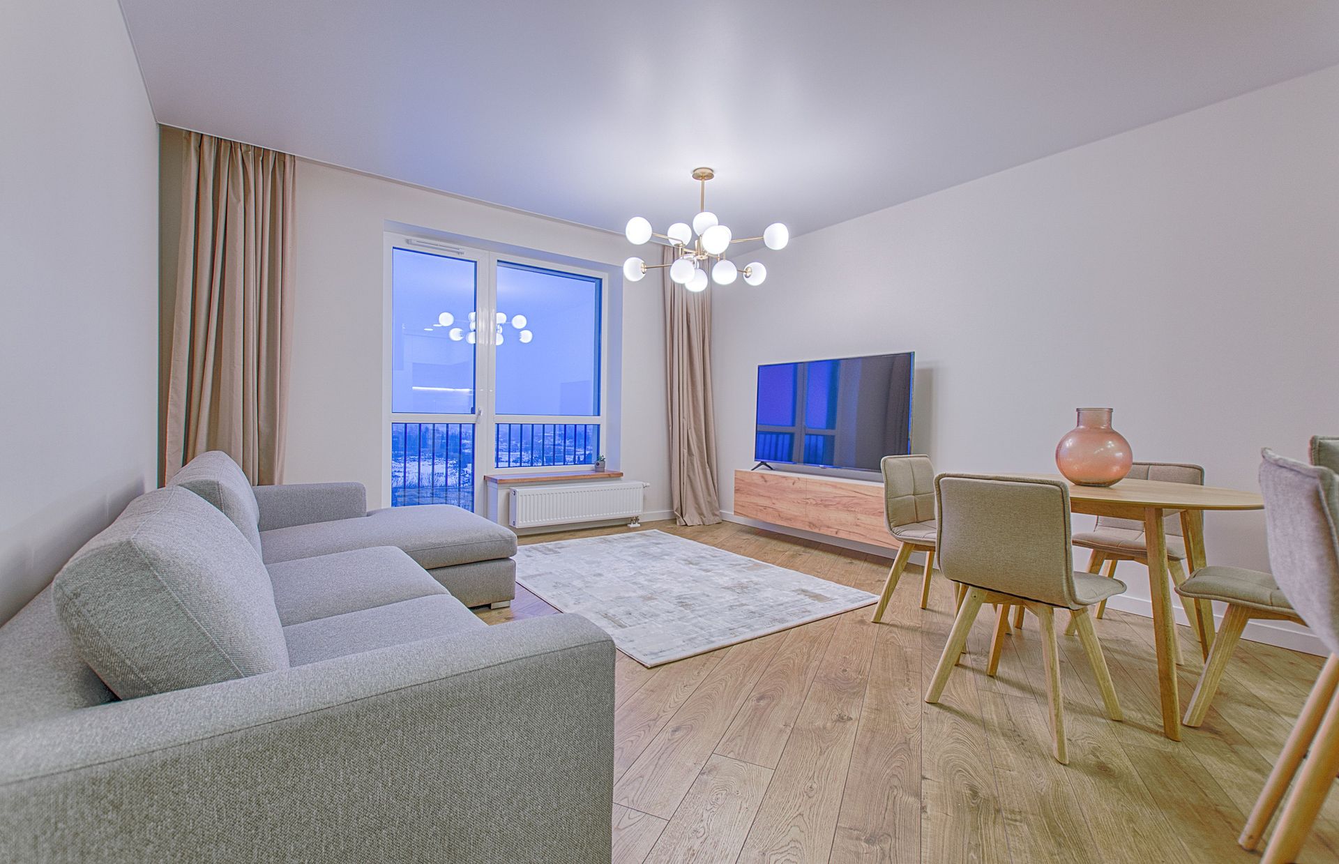 A spacious modern living room featuring stylish furnishings and decor.