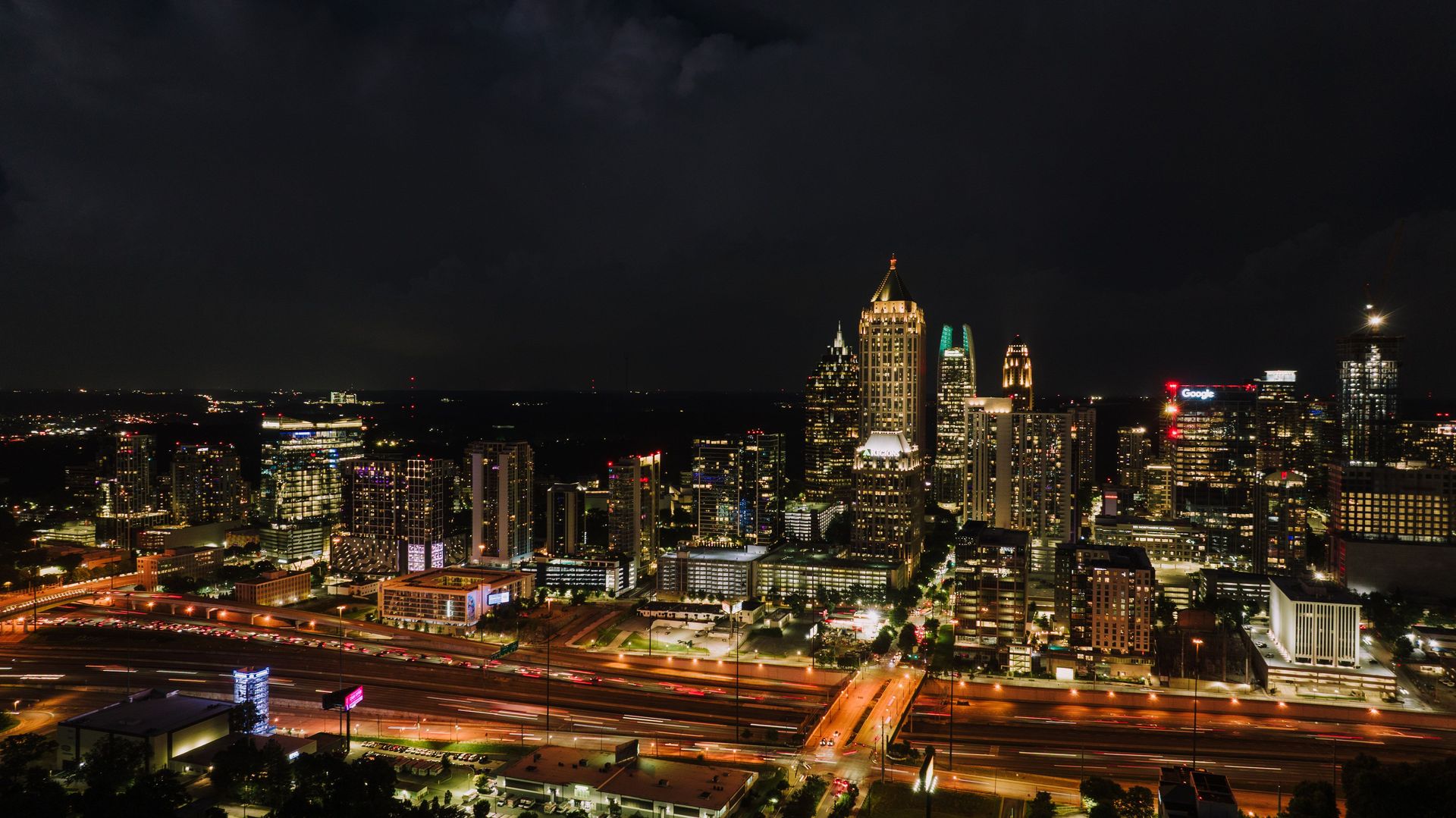 Discover the vibrant Atlanta skyline at night, showcasing the city's illuminated skyscrapers and bustling streets.